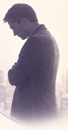 A leader with head bowed, arms crossed